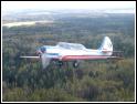 Yak-52 gaining altitude after take-off