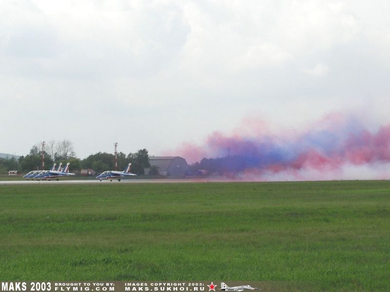 Alpha-Jet. Four jets taking-off with smoke.